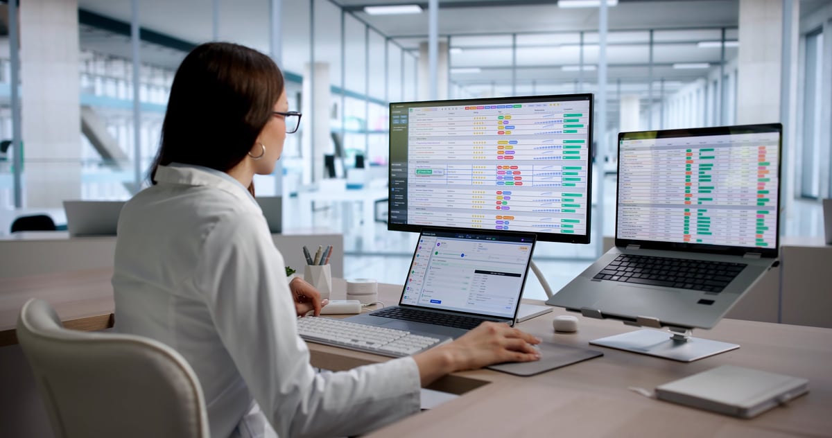 Young Woman Medical Coding Specialist Reviews Billing Data On Laptop Screen